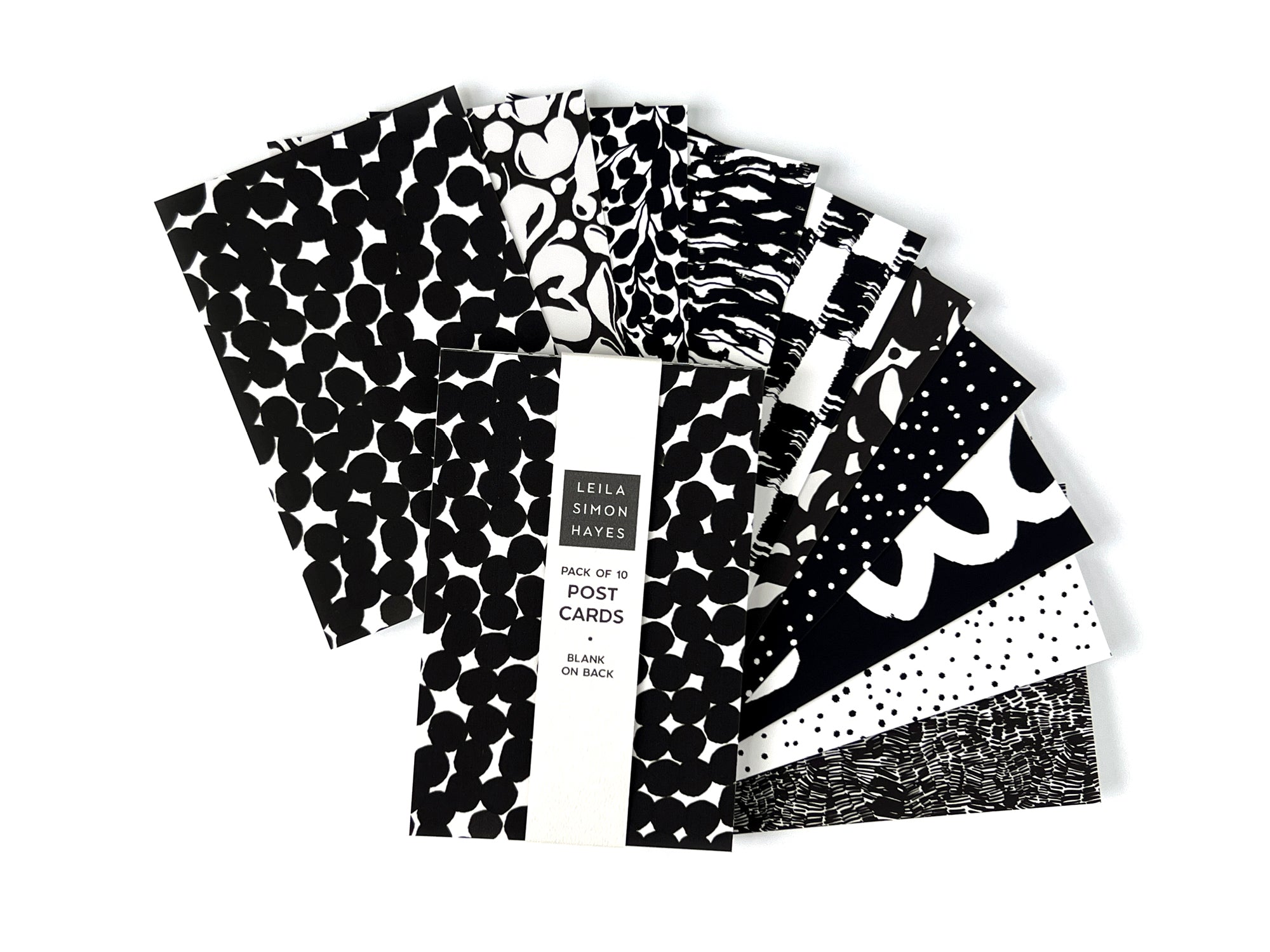 Pack of 10 black and white patterned postcards, designed by artist Leila Simon Hayes on a white background. Blank on other side of postcards.