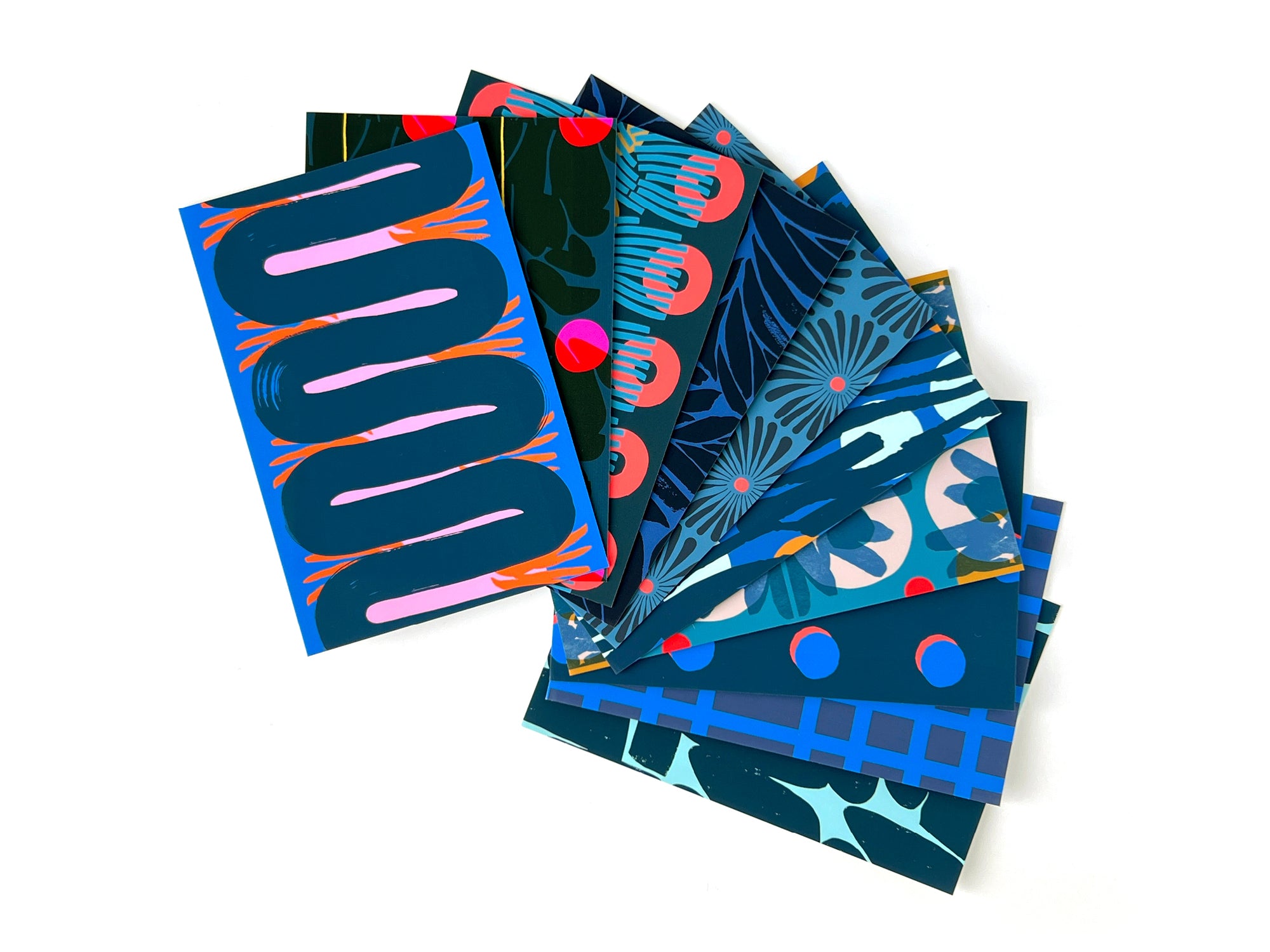 10 blue postcards with various abstract patterns. Designed by artist Leila Simon Hayes.