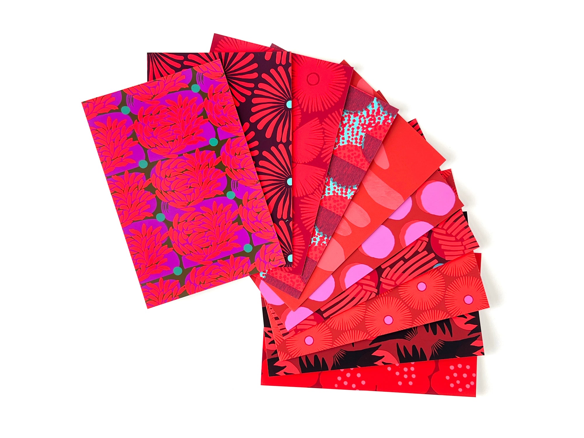 10 postcards with red abstract patterns, designed by artist Leila Simon Hayes.