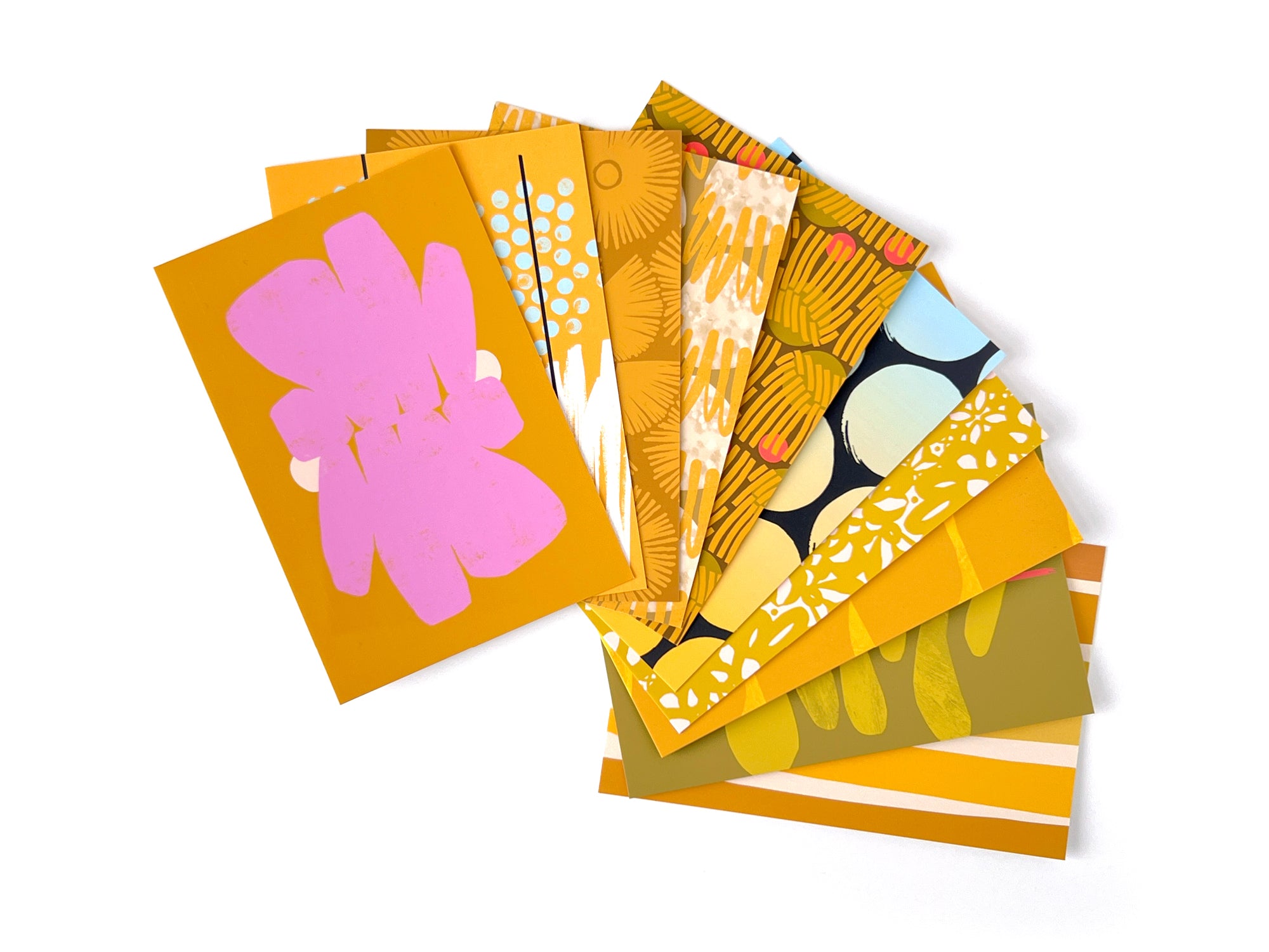 Set of colorful greeting cards with various patterns on a white background, designed by artist Leila Simon Hayes.