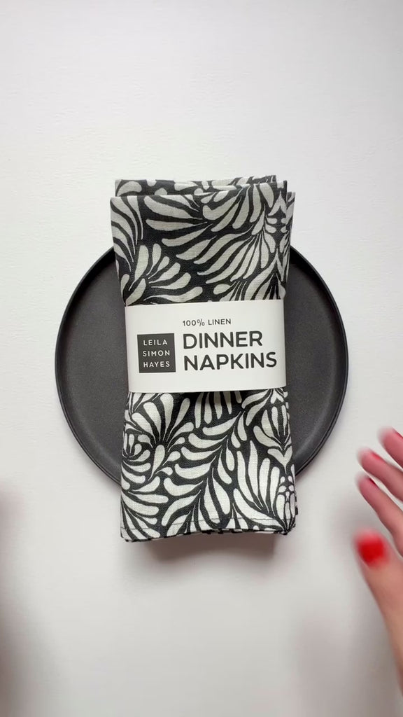 Black and white linen dinner napkin. Designed by artist Leila Simon Hayes.