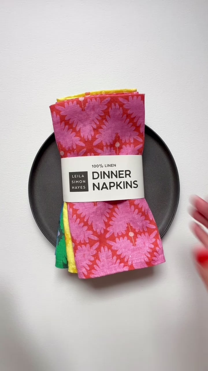 Pack of 4 linen dinner napkins. Designed by artist Leila Simon Hayes. 